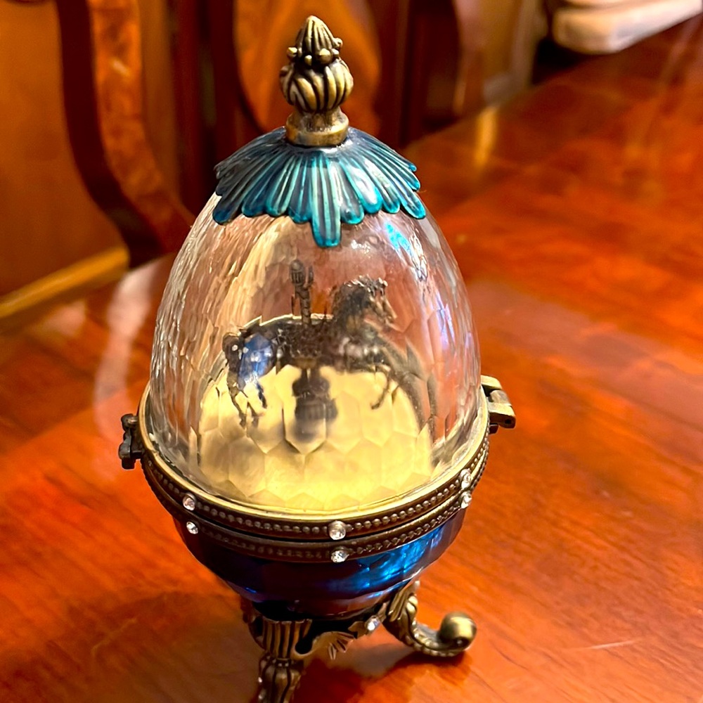 Brass egg shaped musical carasel horse
